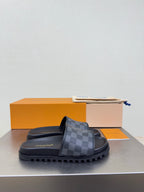 Louis Vuitton slide sandals with dark check-pattern strap and thick rubber sole