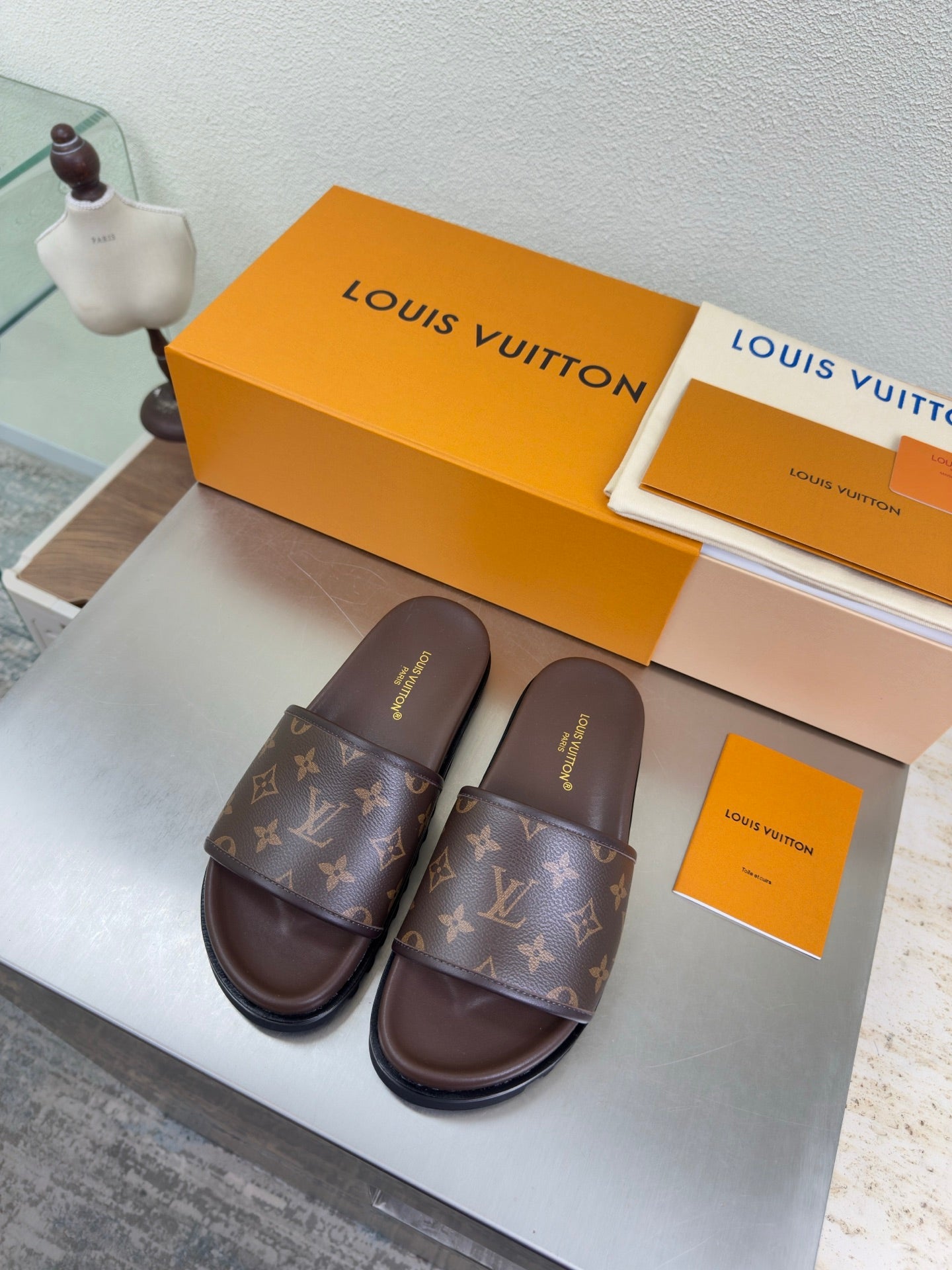 Louis Vuitton monogram slide sandals in dark brown with chunky sole