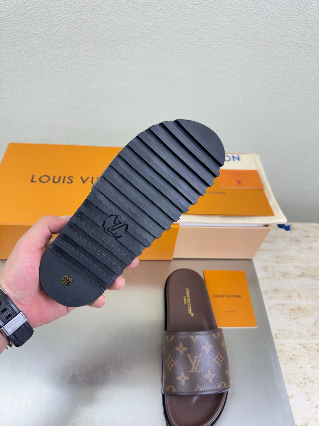 Louis Vuitton slide sandal outsole with ridged rubber tread