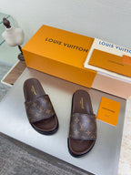 Louis Vuitton monogram slide sandals with dark brown footbed and thick sole
