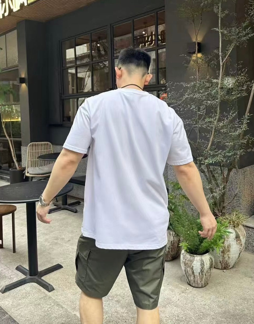Olive cargo shorts with back pockets and relaxed fit, viewed from behind