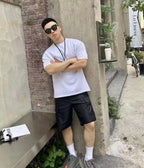 Prada black cargo shorts with relaxed fit and side flap pocket