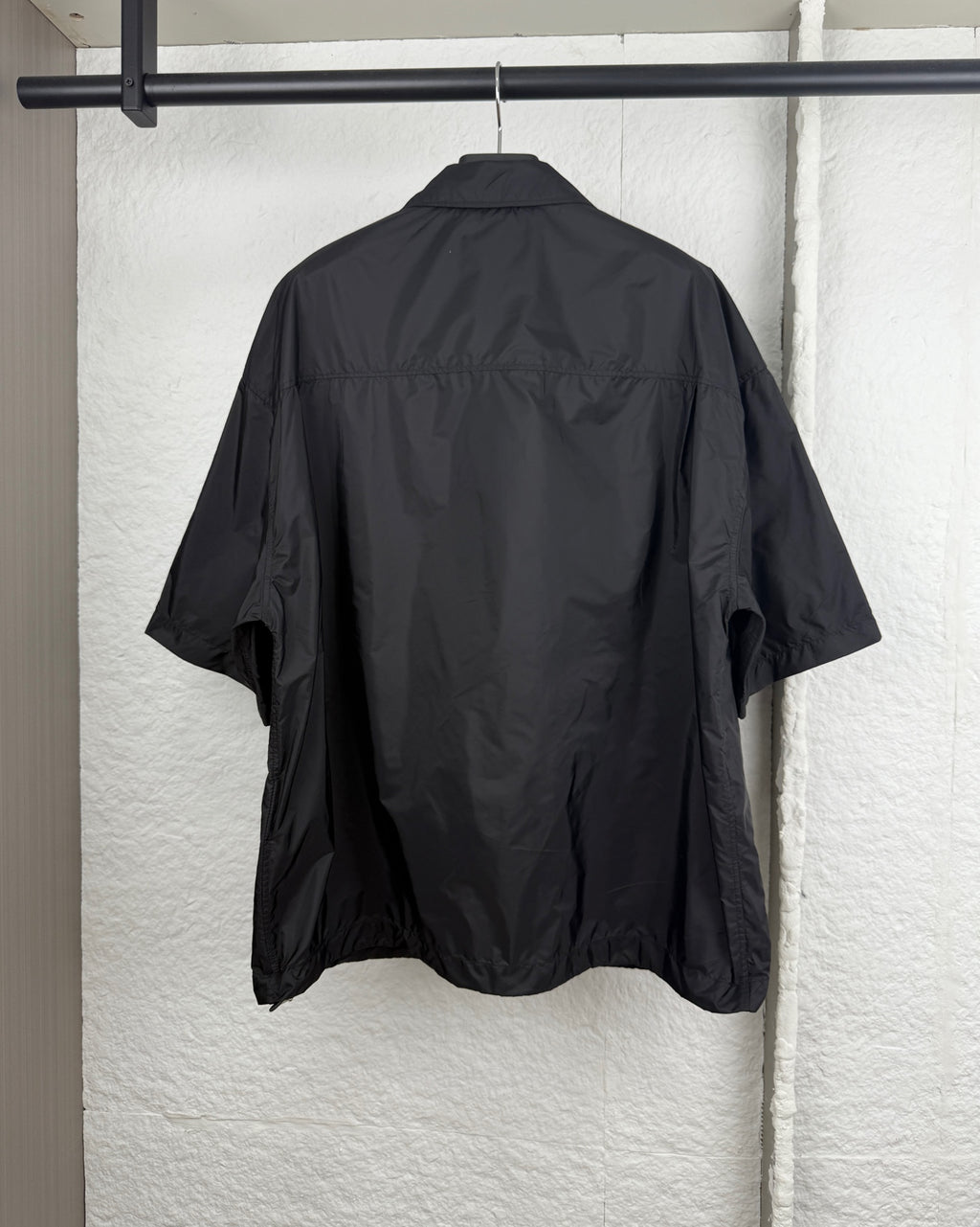 Prada short jacket back view with relaxed short sleeves and shoulder shaping