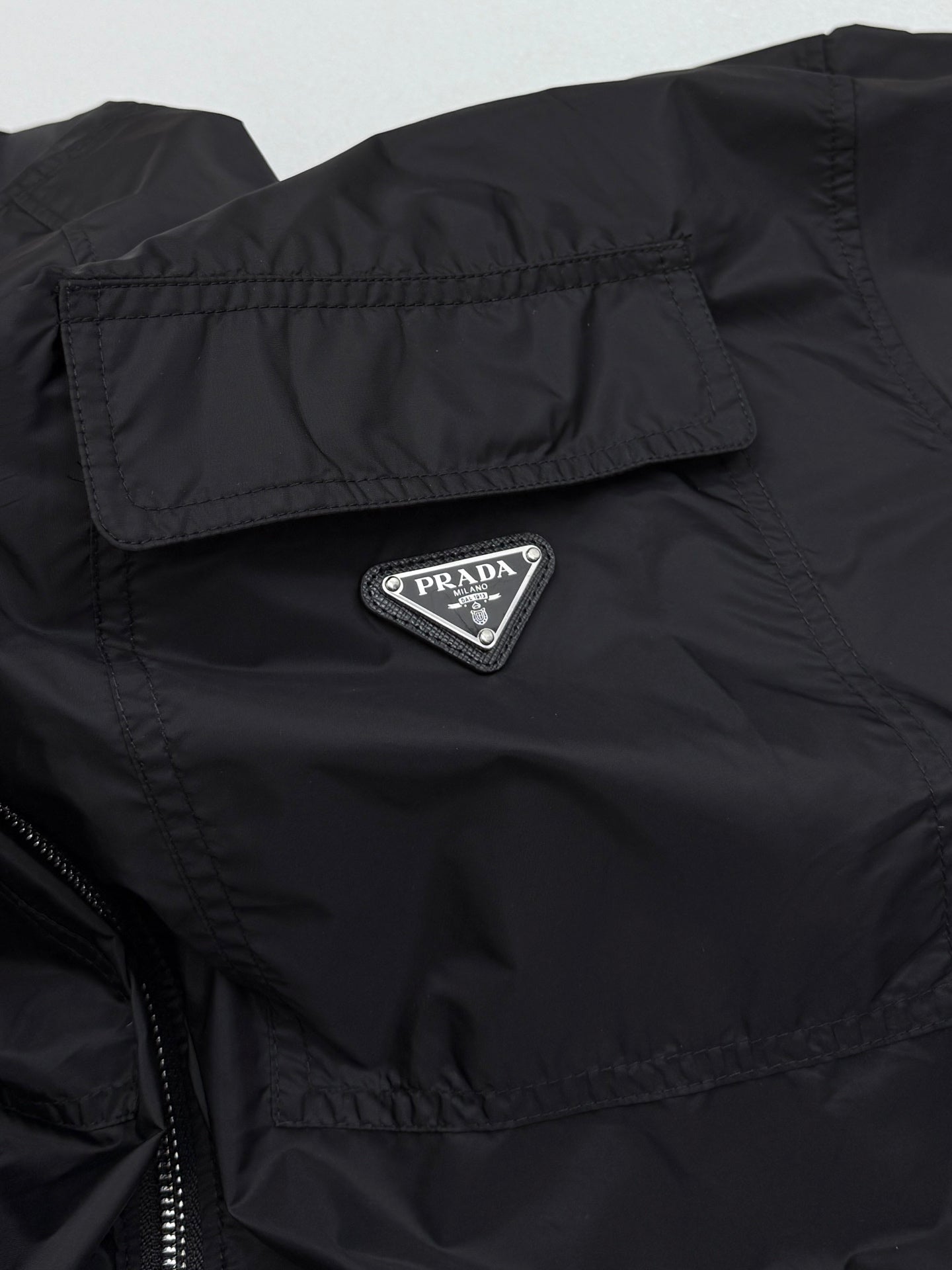 Prada short jacket chest logo patch with triangular PRADA emblem