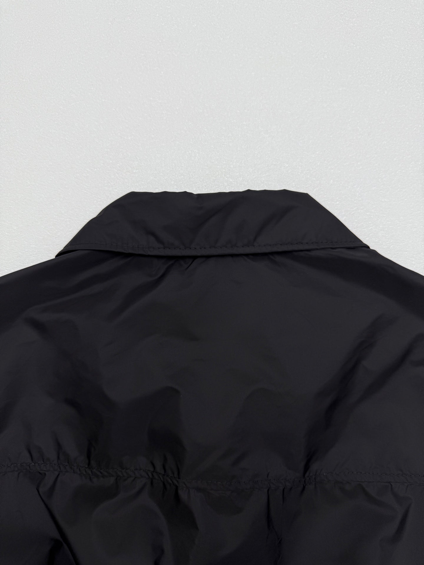Prada short jacket back upper yoke with curved collar and shoulder gathers