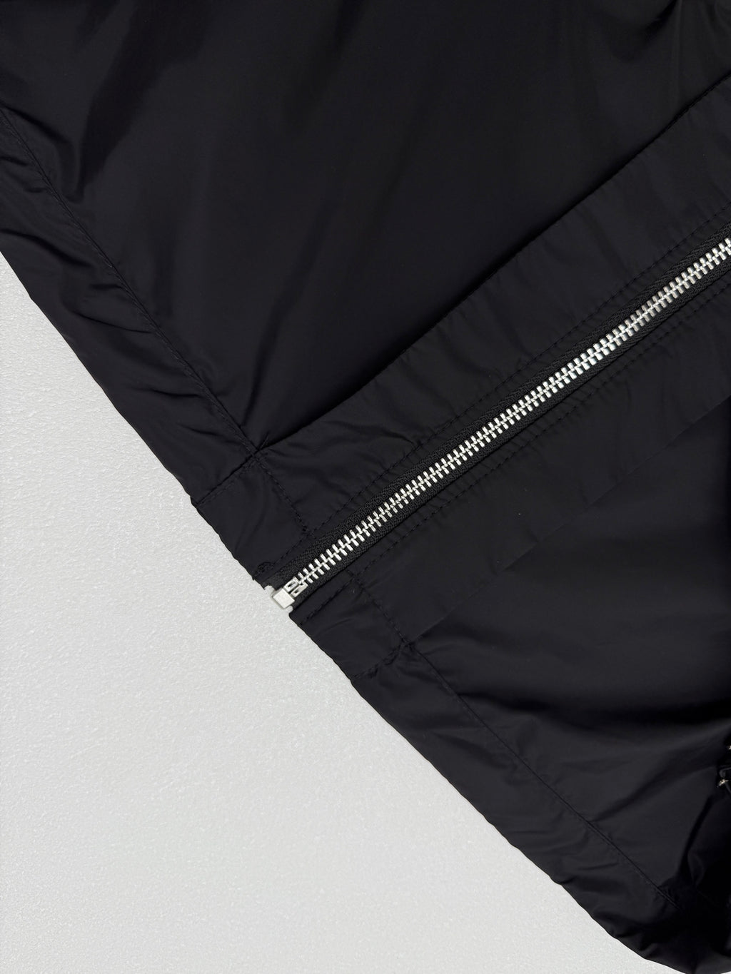 Prada short jacket sleeve and front zipper with metallic pull