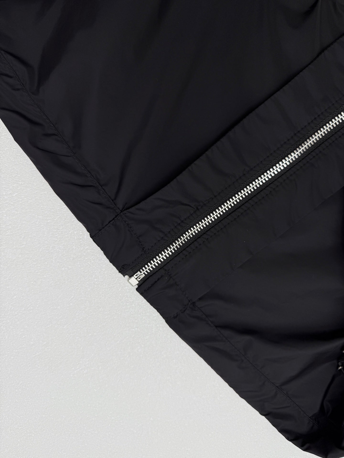 Prada short jacket sleeve and front zipper with metallic pull