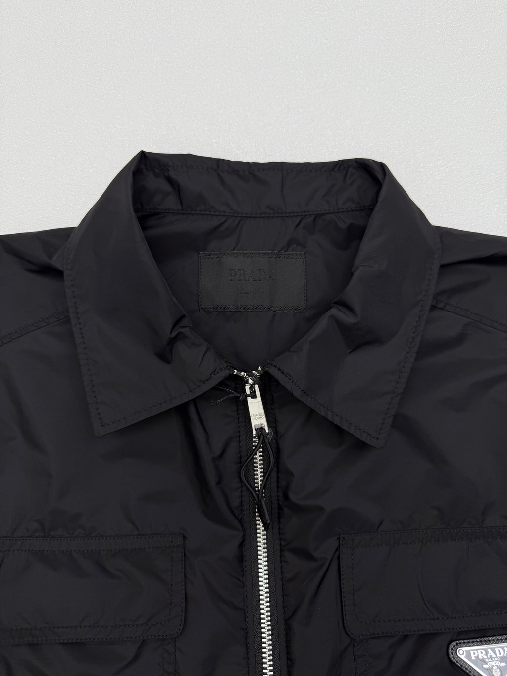 Prada short jacket collar and front zip detail with stitched chest pockets