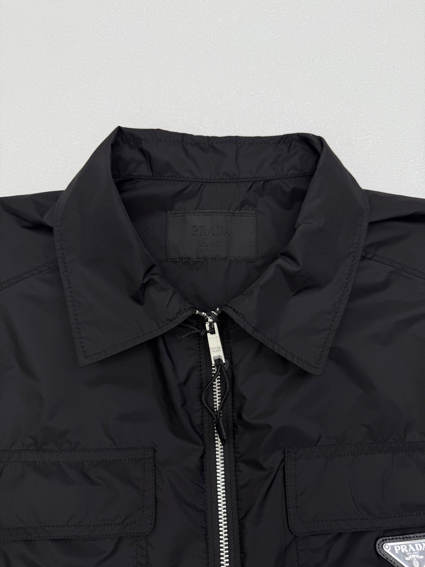 Prada short jacket collar and front zip detail with stitched chest pockets