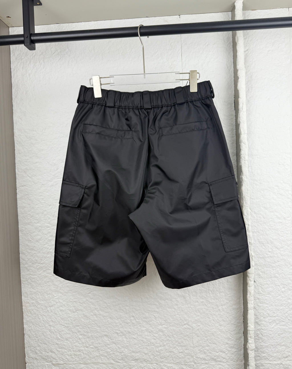 Prada black cargo shorts with knee-length fit and cargo flap pockets