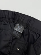 Prada black cargo shorts with hanging care label and side pocket