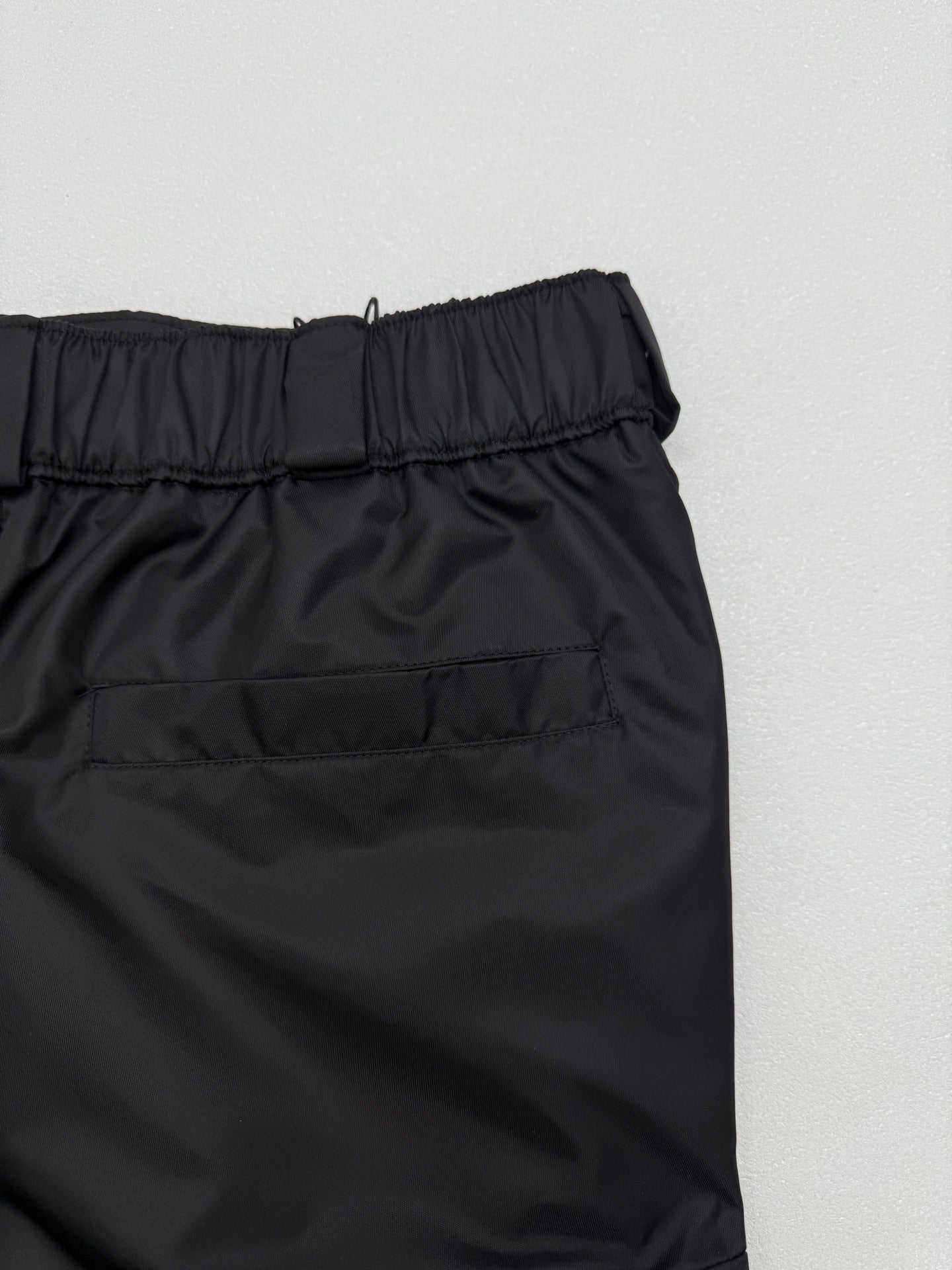 Prada black cargo shorts close-up of elastic waistband and stitching