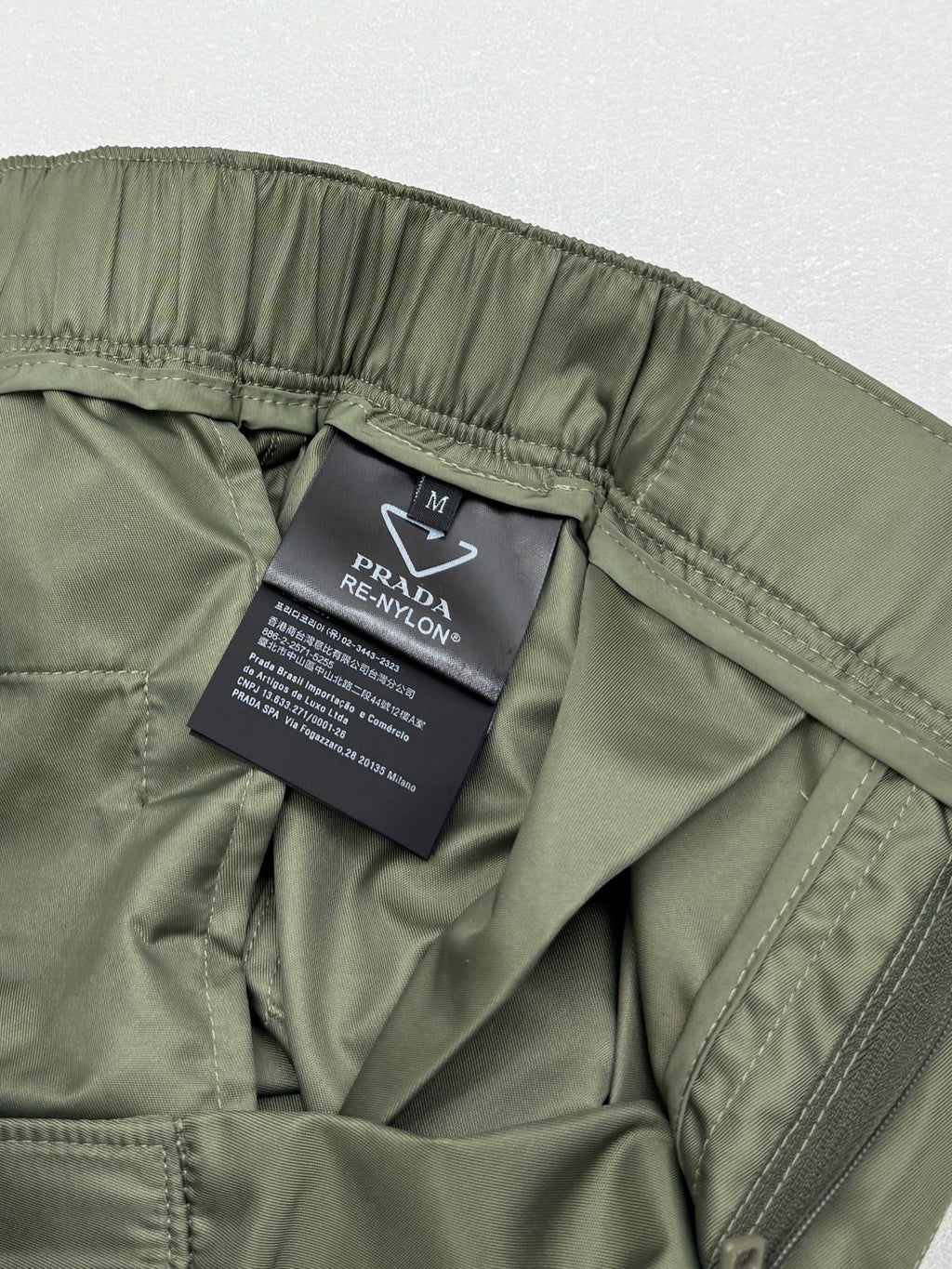 Olive cargo shorts with interior PRADA care label and side seam