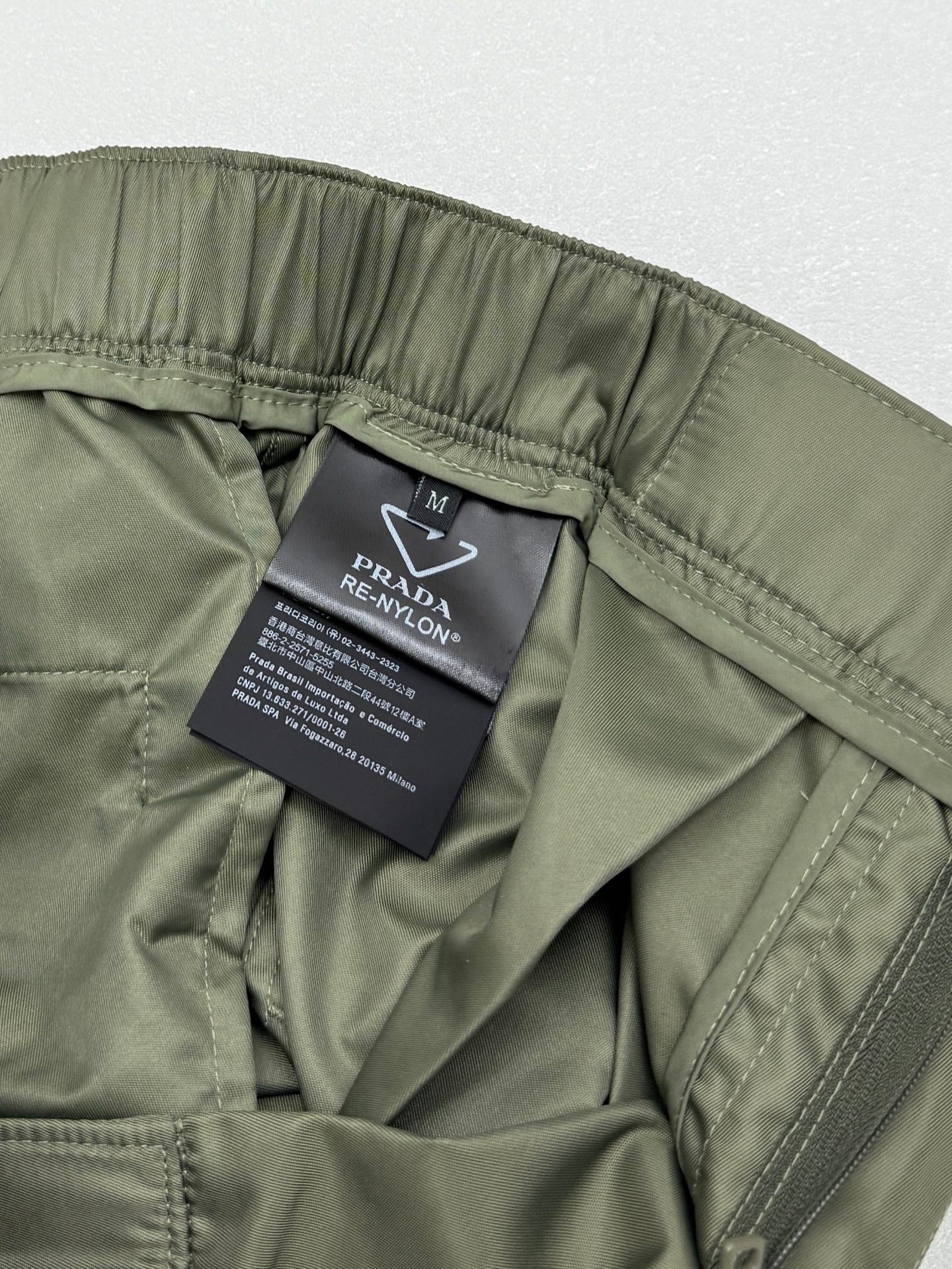 Olive cargo shorts with interior PRADA care label and side seam
