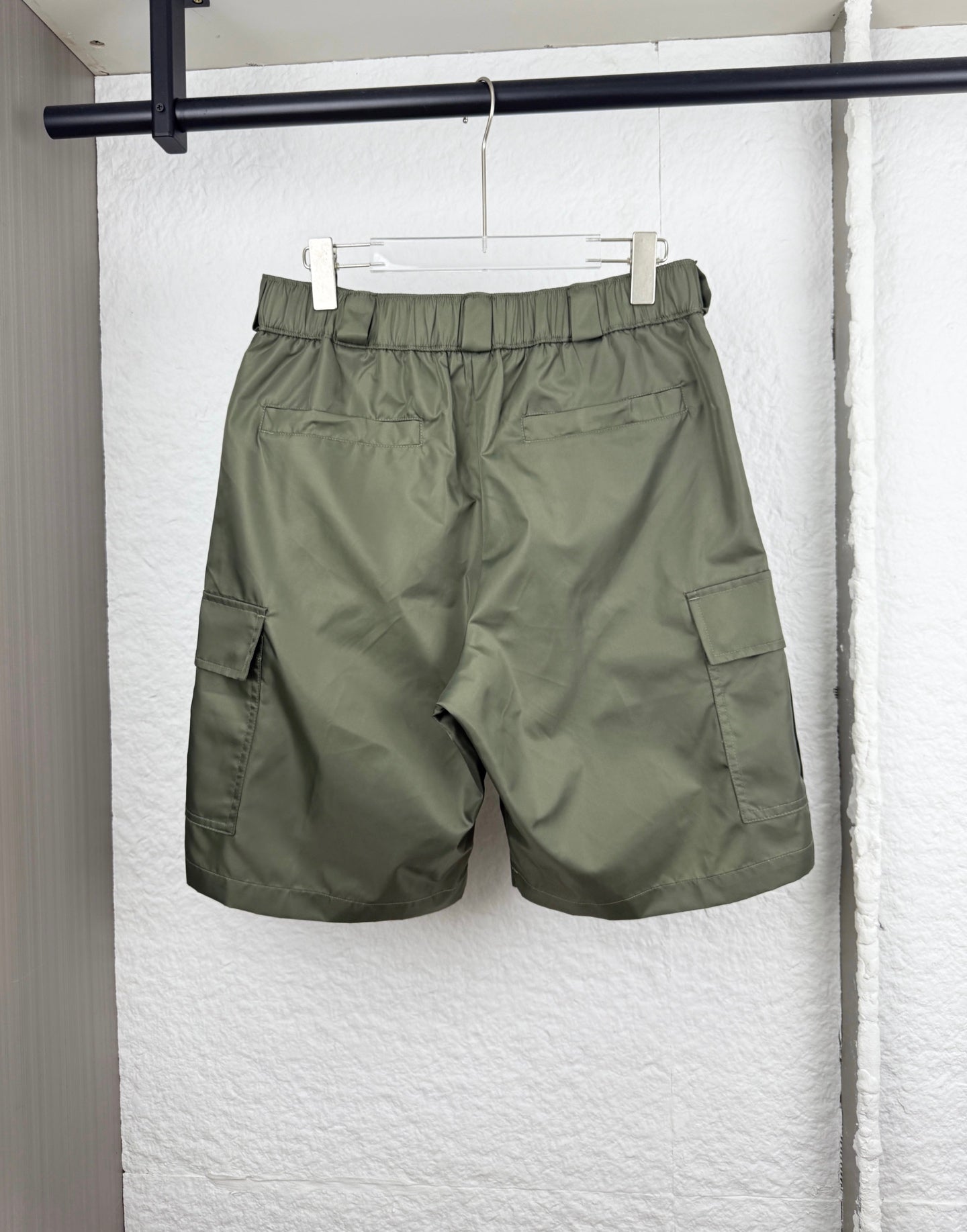 Olive cargo shorts with elastic waistband and cargo pocket detail
