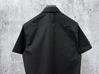 Short-sleeve button-up shirt, dark black, back view with yoke and short sleeves