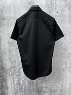 Short-sleeve button-up shirt, dark black, back view with yoke and seam details