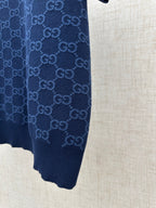 Dark navy polo shirt side view, ribbed cuff and knit hem