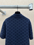 Dark navy polo shirt with GG monogram pattern, back view, ribbed collar