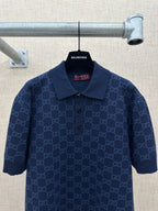Dark navy polo shirt with GG monogram pattern, collared neckline and button front