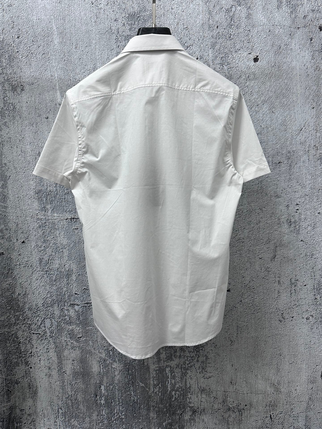 White short-sleeve button-up shirt back view with yoke seam and short sleeves