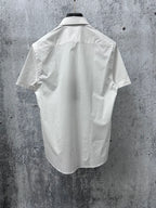 White short-sleeve button-up shirt back view with yoke seam and short sleeves