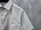 White short-sleeve shirt sleeve and buttoned placket, with small embroidered horse detail