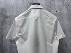 White short-sleeve shirt back view with curved yoke seam and short sleeves