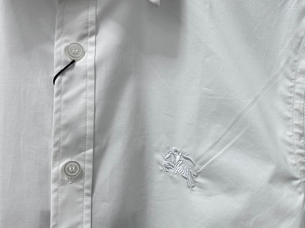 White chest embroidery of a rearing horse on short-sleeve button-up shirt