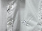 White chest embroidery of a rearing horse on short-sleeve button-up shirt