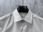 White Burberry short-sleeve shirt neckline with pointed collar and button detail