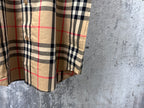 Burberry plaid short-sleeve shirt side view with button front and curved hem