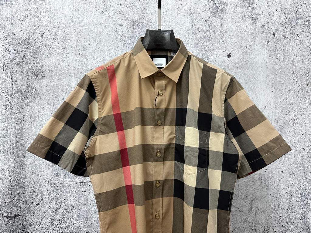 Short-sleeve button-up shirt front view, beige, black, and red plaid pattern
