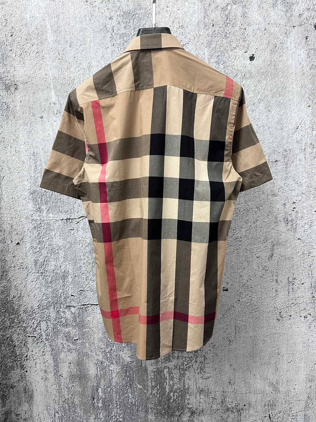 Back view short-sleeve button-up shirt with beige, black, and red plaid