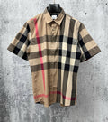 Burberry short-sleeve button-up shirt in beige, black, and red plaid