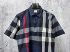 Short-sleeve button-up plaid shirt with navy, white, gray and red check