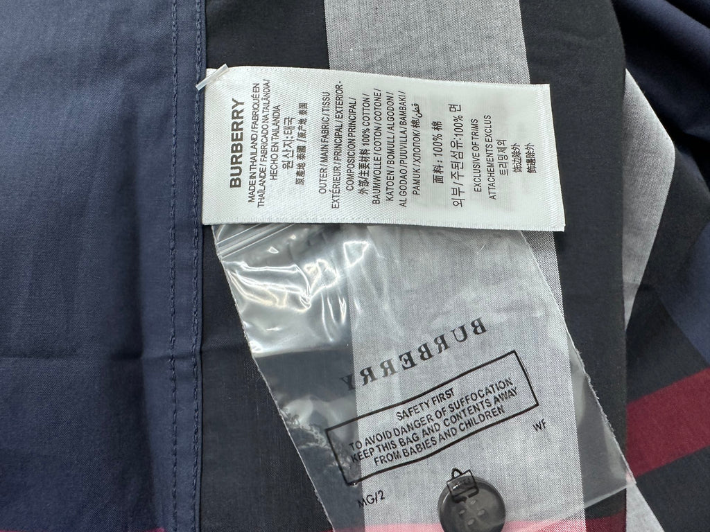 Burberry garment label and care tag inside plaid shirt