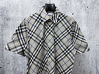 Burberry short-sleeve plaid button-up shirt front; beige, blue, and black check