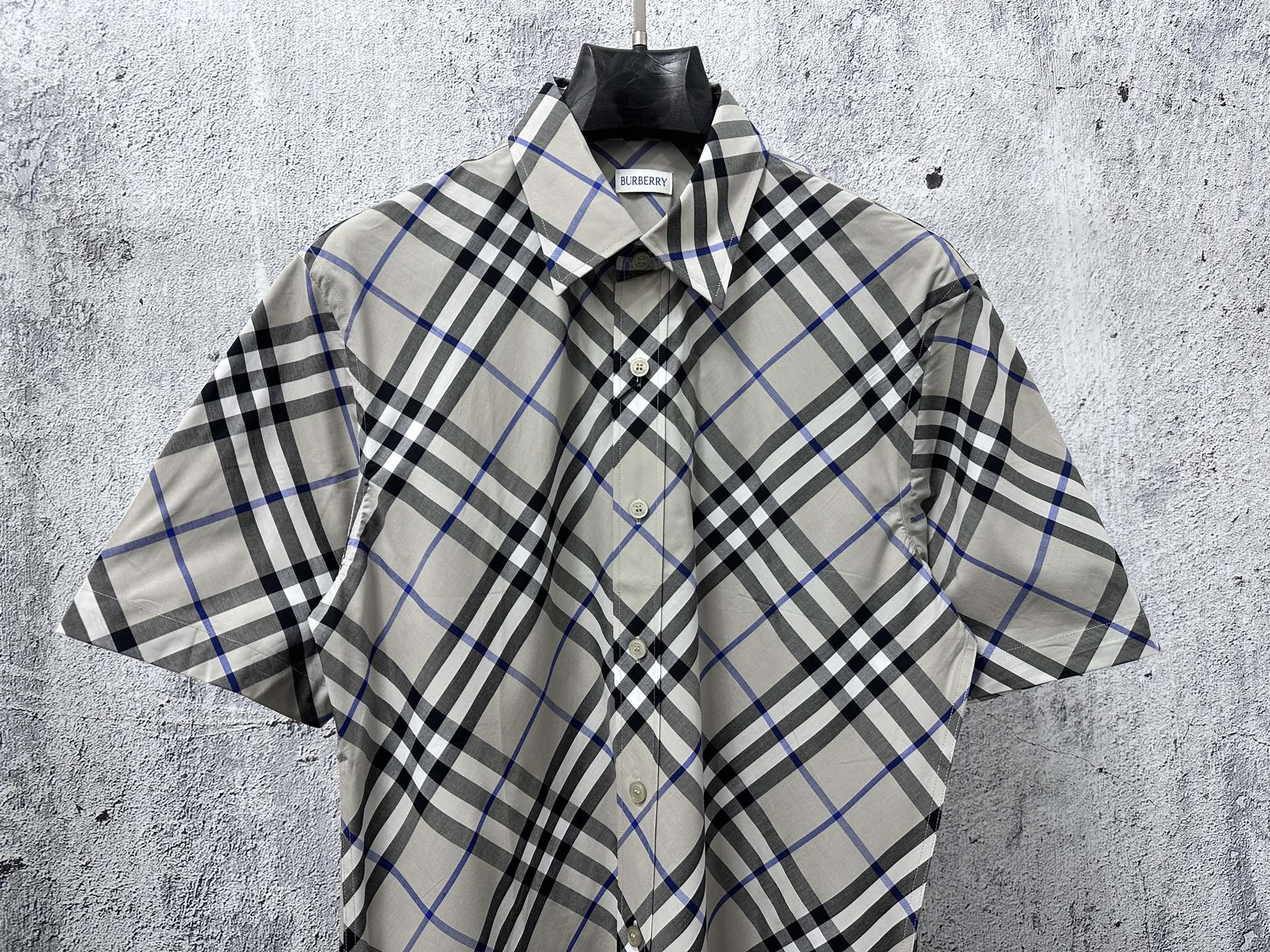 Burberry plaid short-sleeve button-up shirt, front view with collar and placket