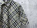 Burberry plaid short-sleeve button-up shirt close-up of front placket and pocket