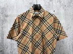 Burberry short-sleeve plaid shirt on hanger with button front and collar