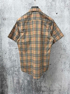 Burberry plaid short-sleeve shirt back view on hanger with check pattern