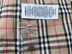 Burberry care label and fabric tag on plaid shirt front