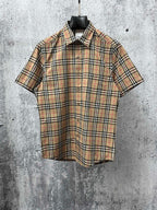 Burberry plaid short-sleeve shirt with button-up front and spread collar