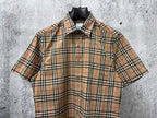 Burberry plaid short-sleeve shirt front view with button placket and chest seam