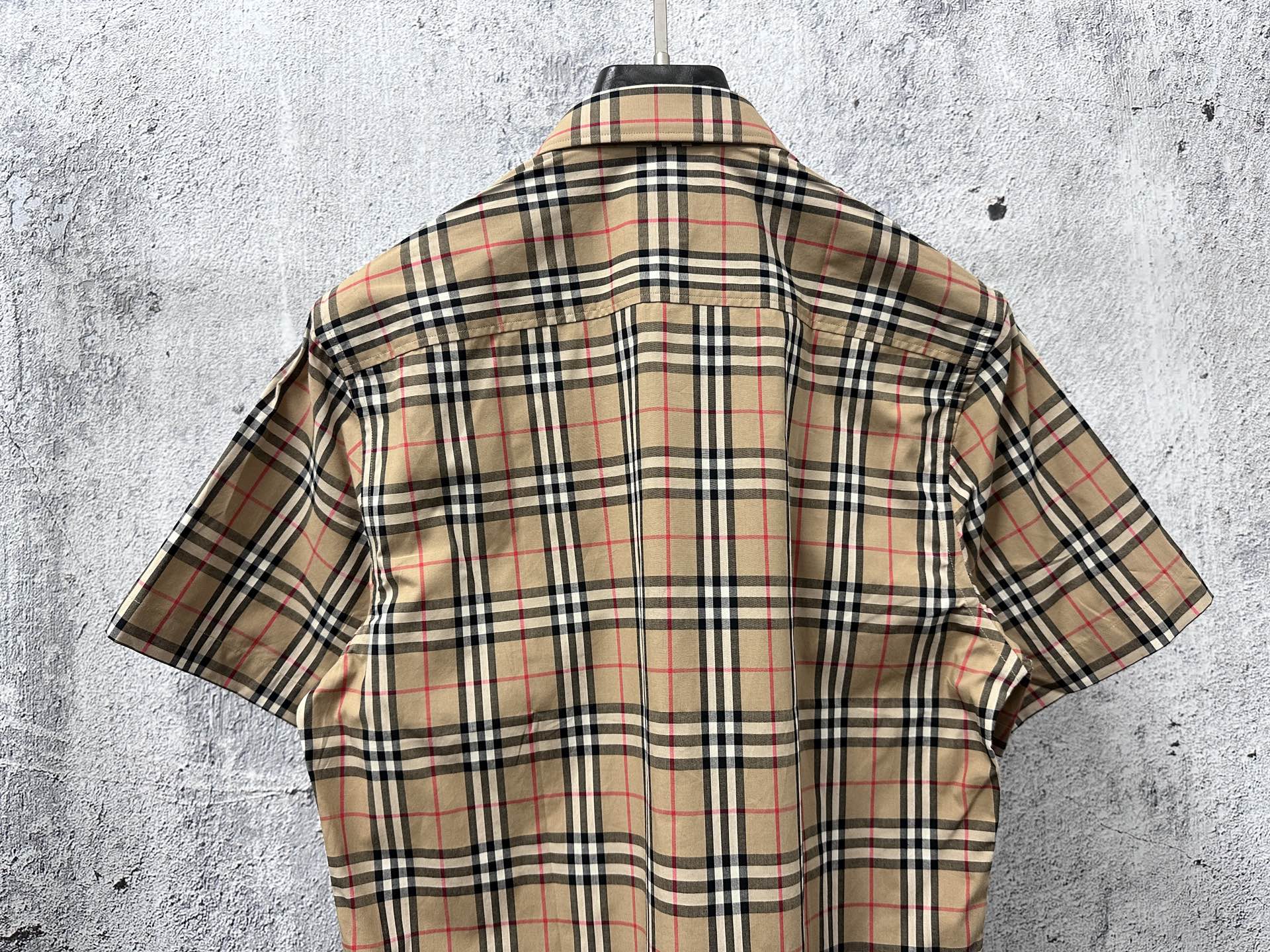 Plaid short-sleeve shirt back view with yoke and shoulder seams