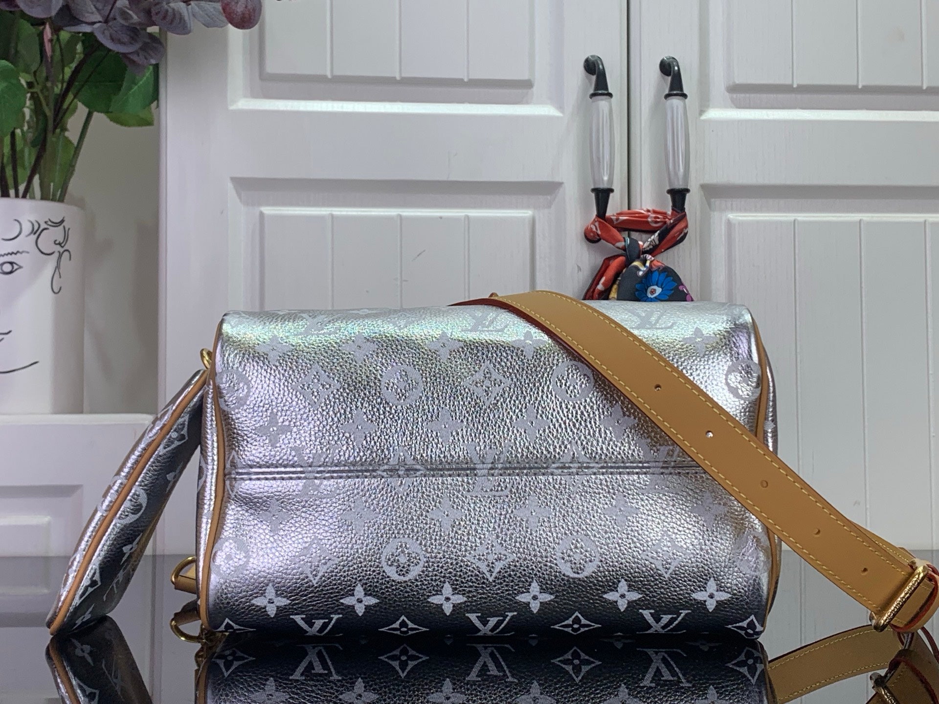 Louis Vuitton shoulder bag with silver monogram canvas, tan strap and flap front