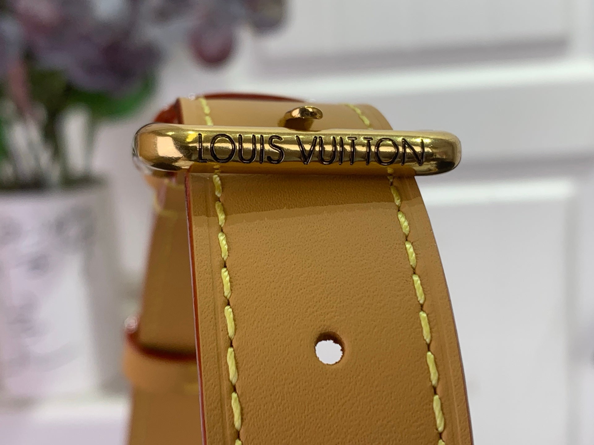 Louis Vuitton bag top clasp with tan leather and gold logo hardware