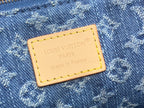 Tan leather brand patch with Louis Vuitton PARIS text on denim monogram fabric