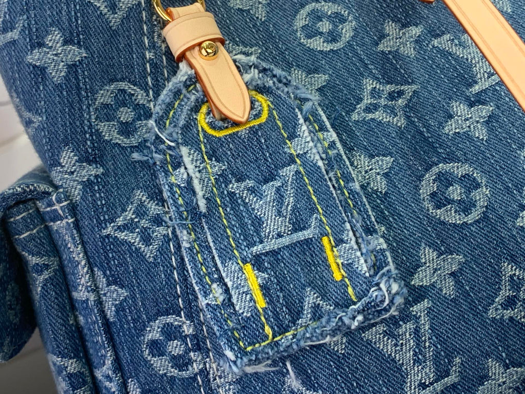 Denim monogram fabric pocket with tan tab and multicolor contrast stitching